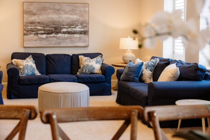 Comfortable and stylish living room with sofas and fireplace at The Hideaway cottage